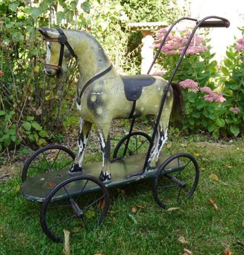 Gamage&rsquo;s child&rsquo;s push along wooden painted toy horse and dolls pram, circa 1900,