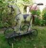 Gamage&rsquo;s child&rsquo;s push along wooden painted toy horse and dolls pram, circa 1900,