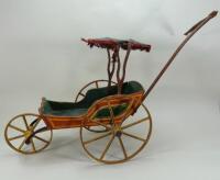 A Victorian painted wooden dolls carriage,