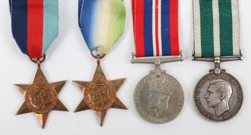 Historically Interesting Royal Naval Reserve Long Service Medal Group of Four, Crewman of the Armed Merchant Cruiser HMS Voltaire, Who Was Taken Prisoner of War After the Gallant Last Stand Action Against the German Auxiliary Cruiser Thor, off the Cape Ve