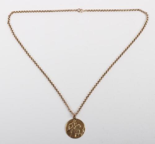 A 9ct gold chain and 9ct pendant of St Christopher