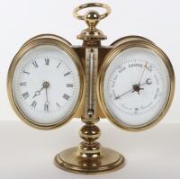 A late 19th century brass desk combination barometer and clock