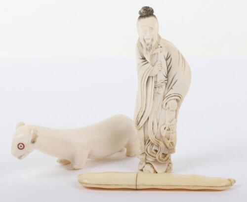 >A 19th century Japanese ivory bean, a Okimono of an elder and an Inuit carved bone polar bear