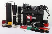 A selection of vintage cameras, lens’ and camera equipment