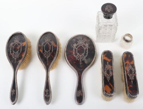 An early 20th century silver, tortoiseshell and pique work dressing table set, Charles Henry Dumenii, London 1917