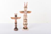 ^ Carved and painted Pacific coast Indian totem made from walrus tusk,