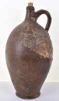 An 18th century glazed stoneware wine bottle, reputedly salvaged from the Dutch East Indian Company ship Amsterdam, wrecked 26th January 1749