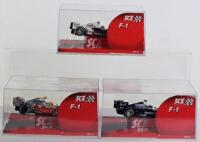 Three Boxed SCX F1 Model Slot Cars